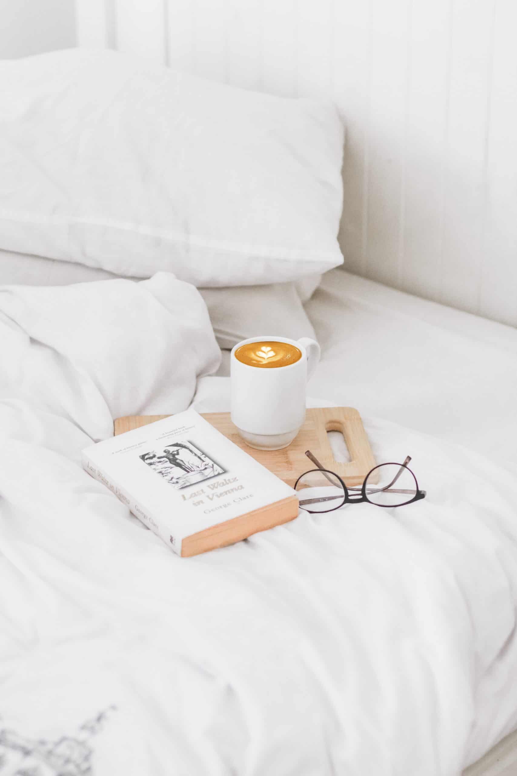 bed book coffee glasses